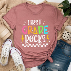 Rock your classroom in style with this Retro First Grade Rocks Teacher Shirt